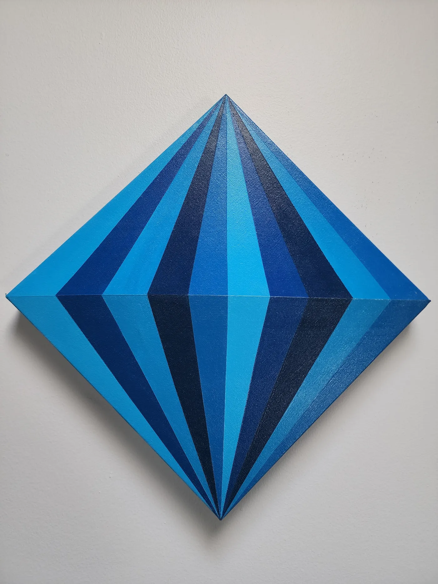 A stylized, diamond art piece with alternating clean blue segments mimicking a gemstone.