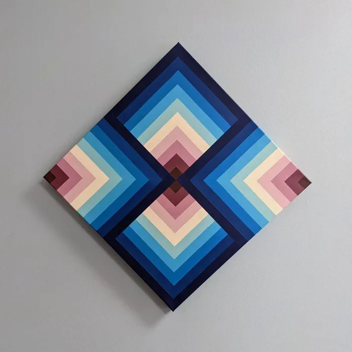 Square canvas hung as a diamond, painted with four sets of nested chevrons in navy, blue, cream and rose radiating from the centre.
