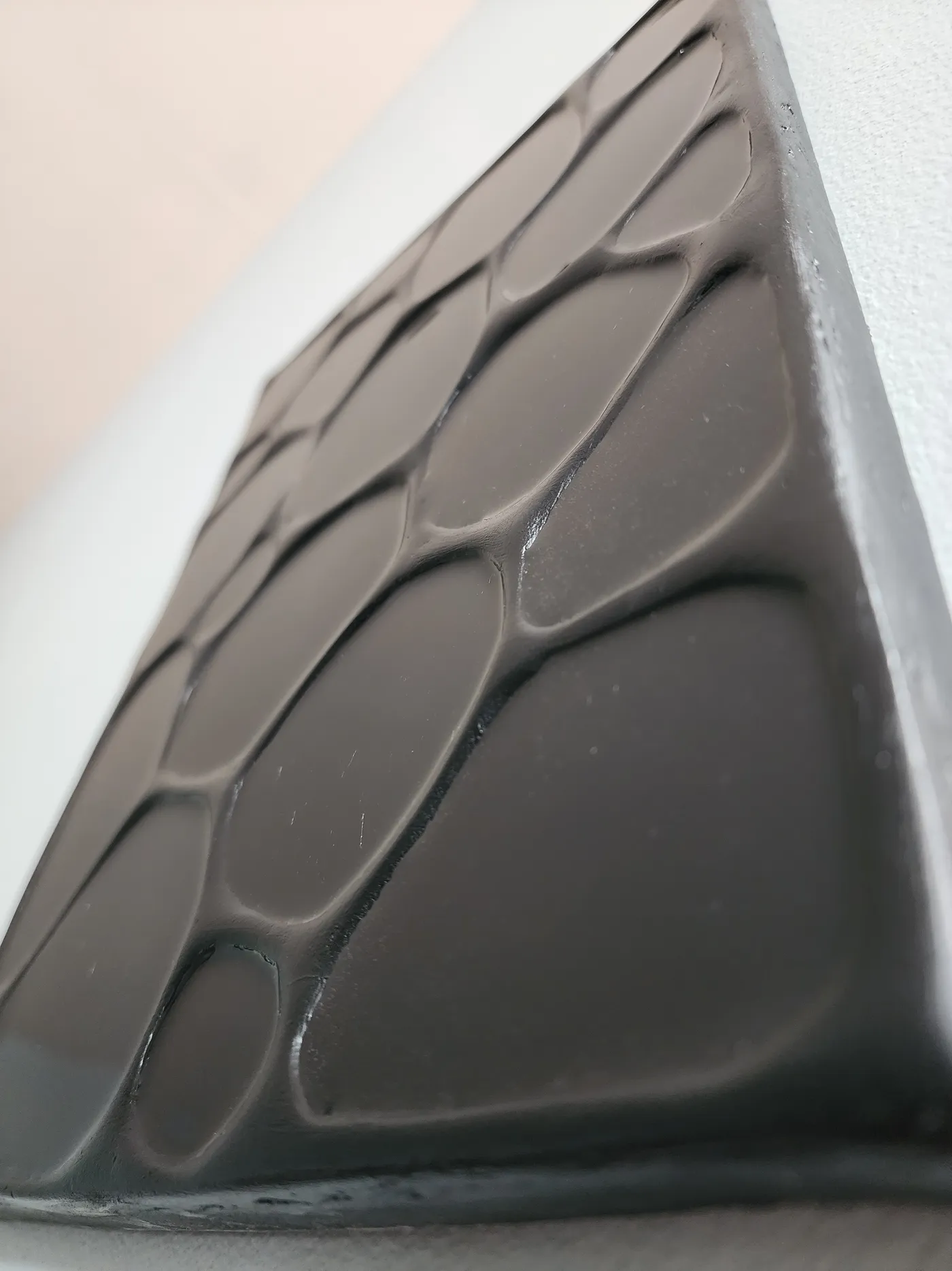 Detail image of gloss black painting on wall